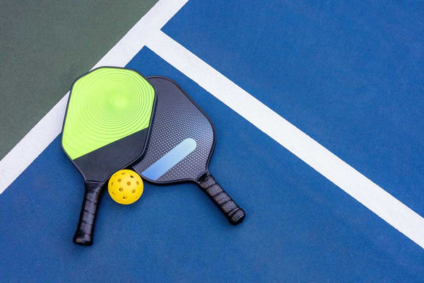 Pickleball paddles on a court
